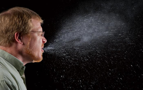 Man Sneezing Germs Shown Spreading
