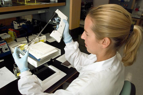 Doctor at CDC Running a Pulsed-field Gel Electrophoresis (PFGE) Analytical Test