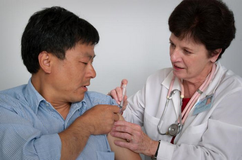 Asian Man Receiving an Immunization