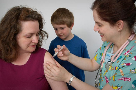 Adult Woman Receiving a Flu Vaccine