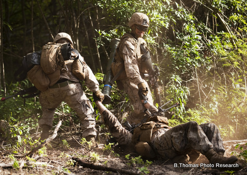 U.S. Marines drag a simulated casualty to safety