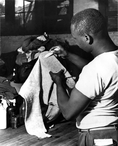 Black Man in 1950s in a Dry Cleaners