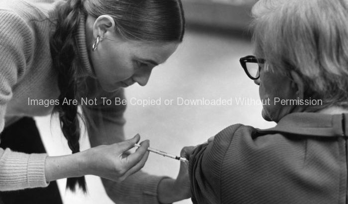 Elderly Female Receiving a Swine Flu Vaccination (1976)