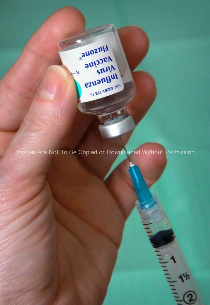 Nurse extracting Influenza Virus Vaccine, Fluzone