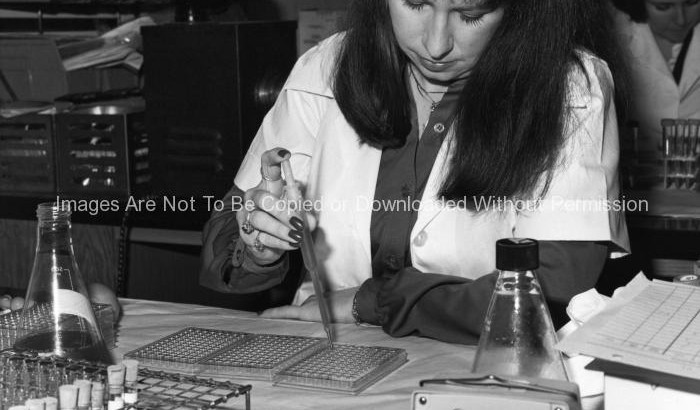 Researcher Using a Pipetter