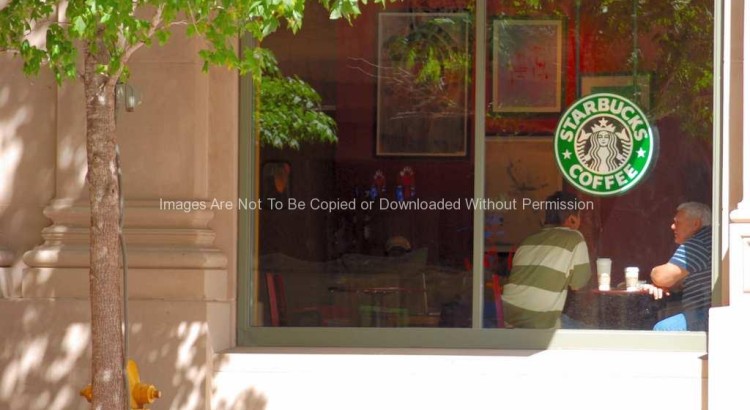 Two men sitting in Starbucks