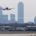 Dallas Skyline in Background as Southwest Jet Lands at Love Field