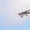 Small prop plane making steep landing approach